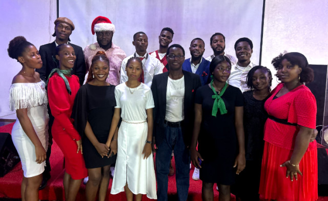 Photo of RCCG, Lively Chapel Parish Pastor, Adebayo Amao (Middle) and choir members at the 2024 Christmas carol celebration held on Sunday in Lagos